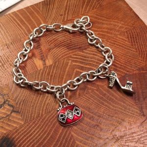 Silver bracelet with two charms